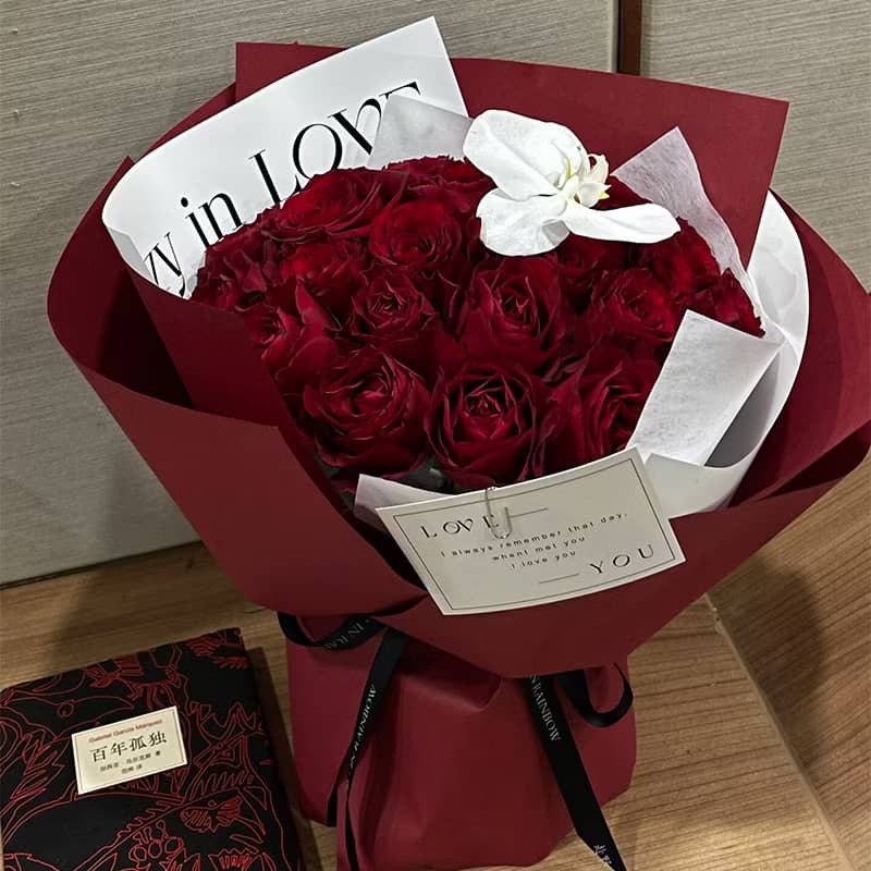Premium flowers bouquet featuring 30 handwrapped red roses with an elegant design and message card.